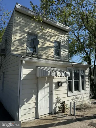 a front view of a house with garage
