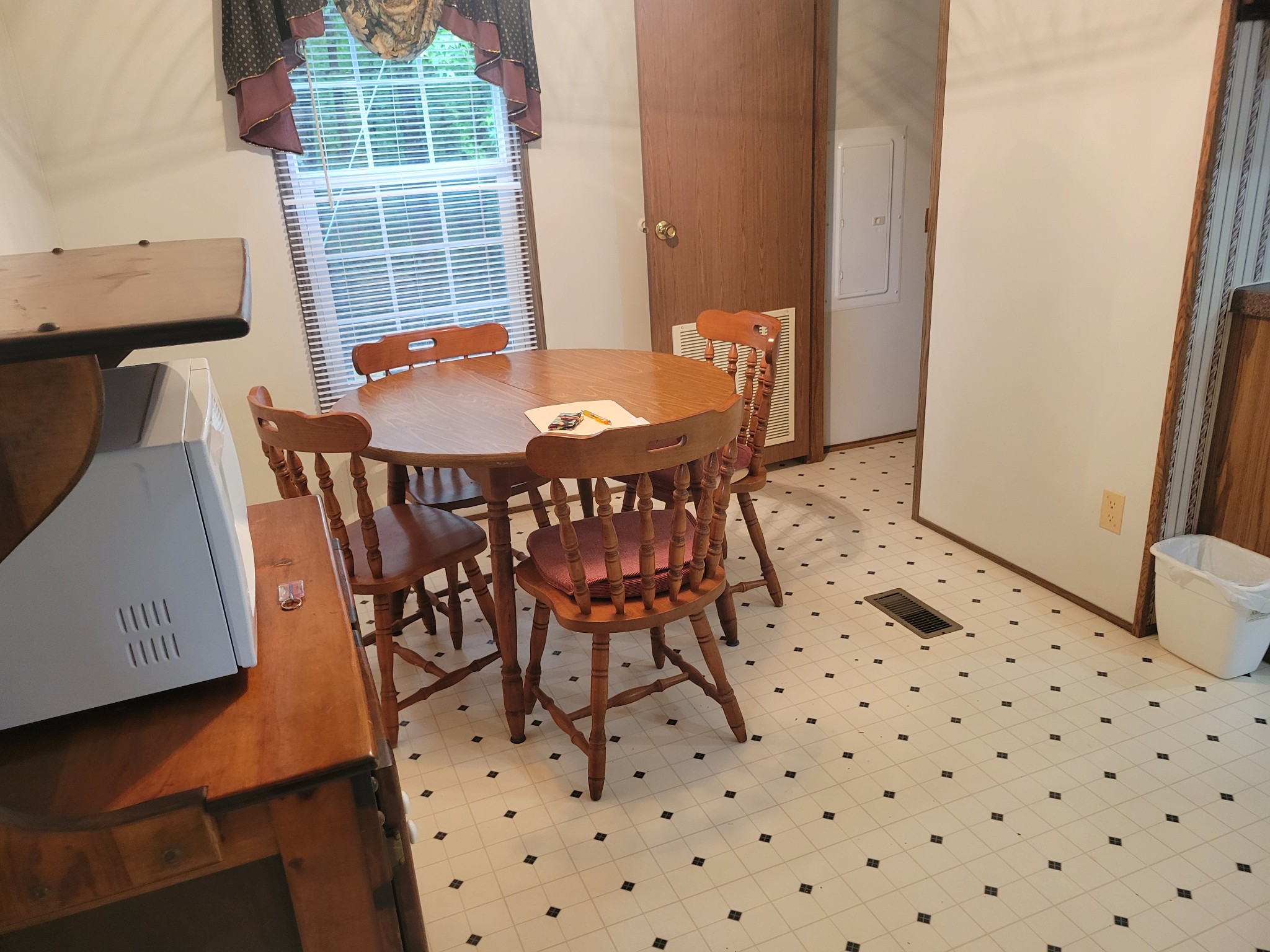 4120 Copper Spring Road Springville, TN 38256 - Photo 6 of 20 a view of a dining room with furniture and wooden floor