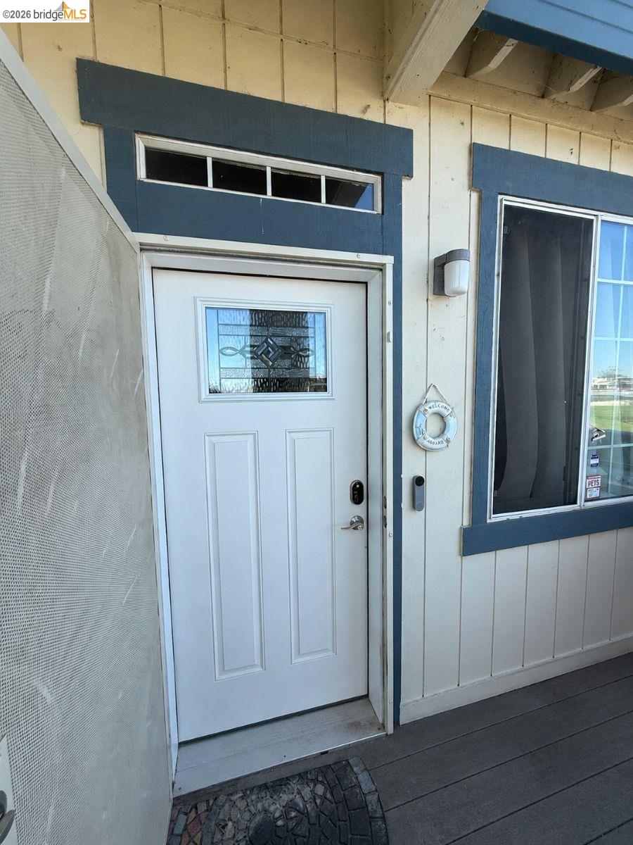3623 Wells Road Oakley, CA 94561 - Photo 38 of 59 White paneled entry door with decorative glass insert and transom window