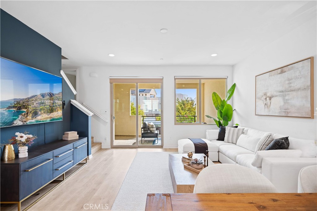 115 Episode Irvine, CA 92618 - Photo 22 of 43 a living room with furniture and a flat screen tv