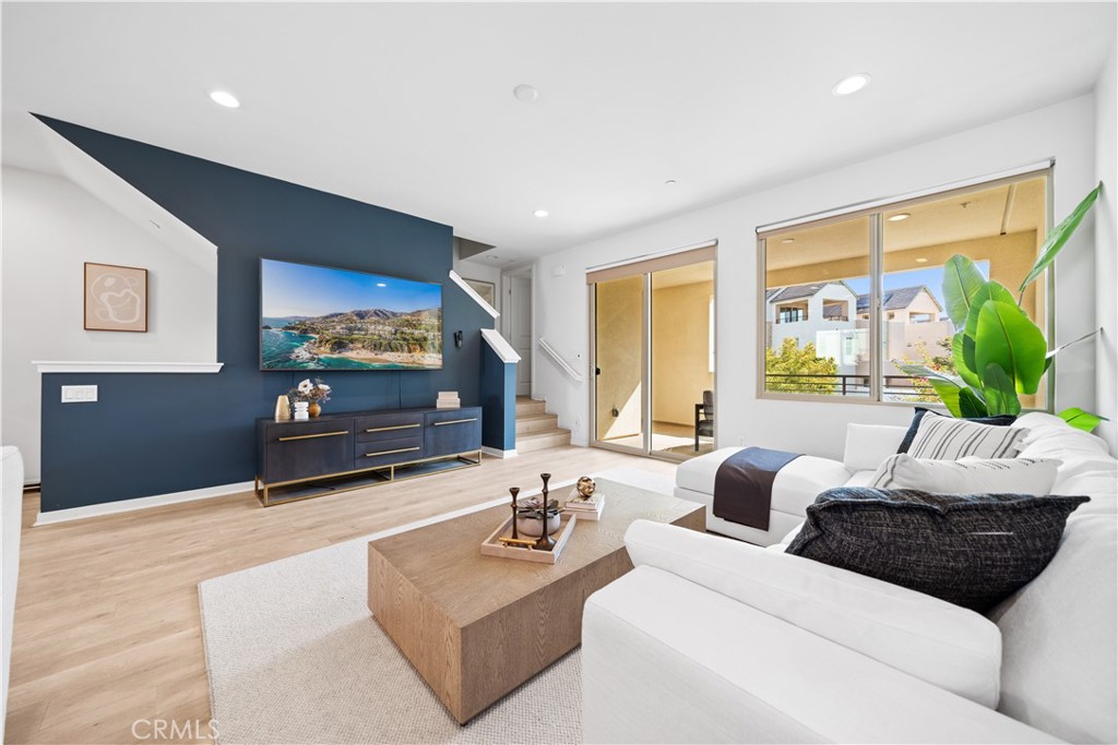 115 Episode Irvine, CA 92618 - Photo 23 of 43 a living room with furniture and a flat screen tv