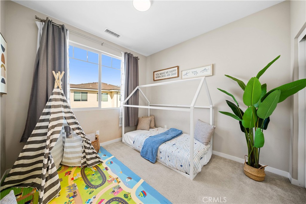 115 Episode Irvine, CA 92618 - Photo 31 of 43 a bed sitting in a bedroom next to a window