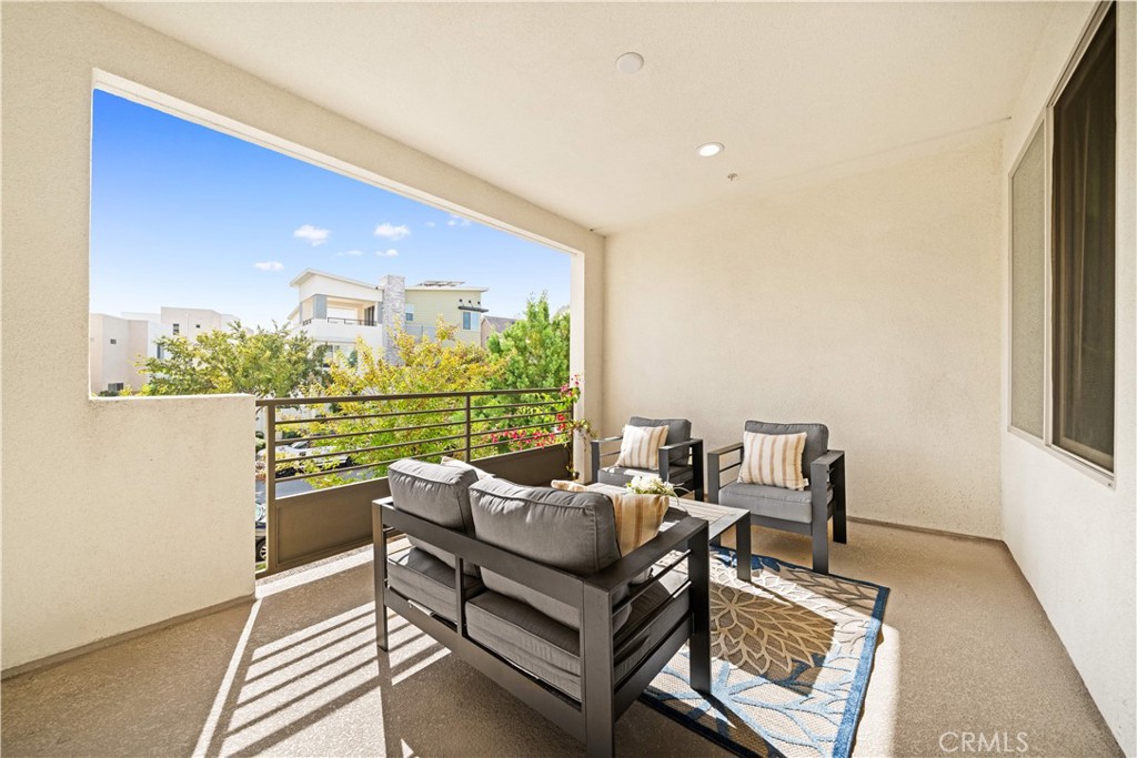 115 Episode Irvine, CA 92618 - Photo 34 of 43 a living room with furniture and a floor to ceiling window