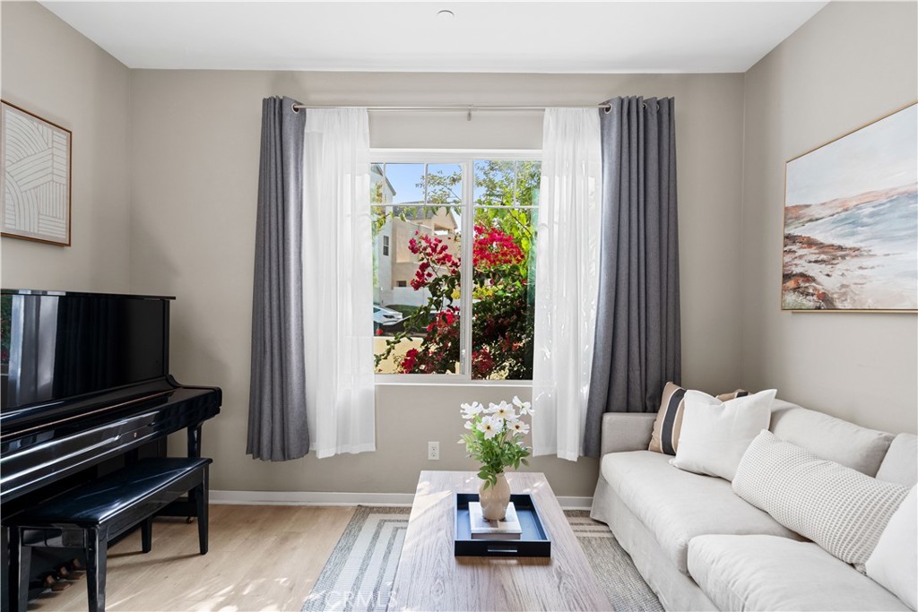 115 Episode Irvine, CA 92618 - Photo 8 of 43 a living room with furniture and a flat screen tv