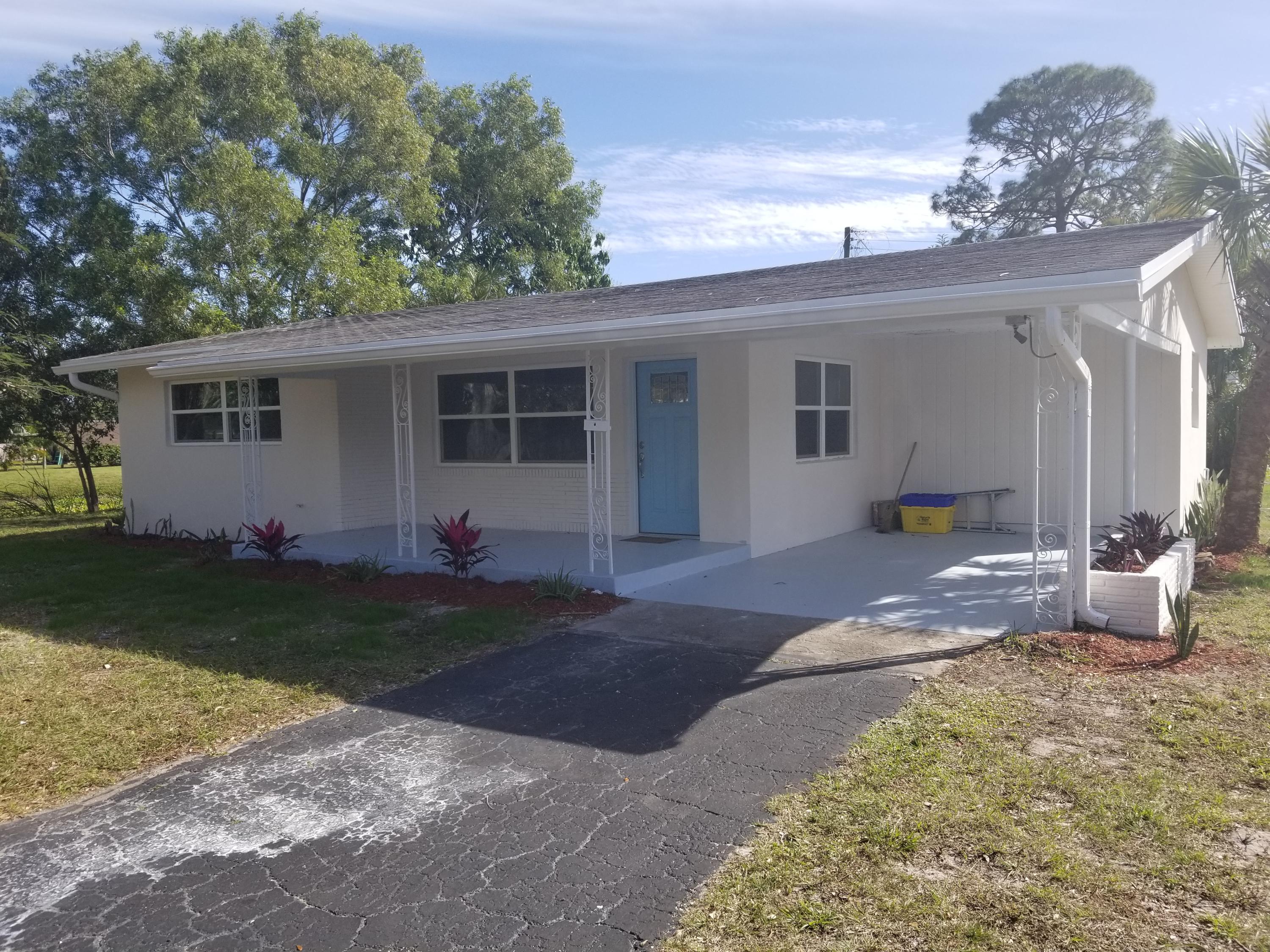 58 Springdale Road Lake Worth, FL 33467 - Photo 1 of 15 Front