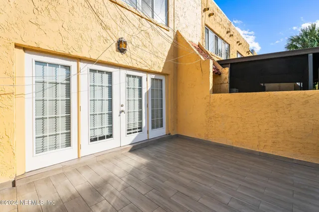 front view of a house with a large window