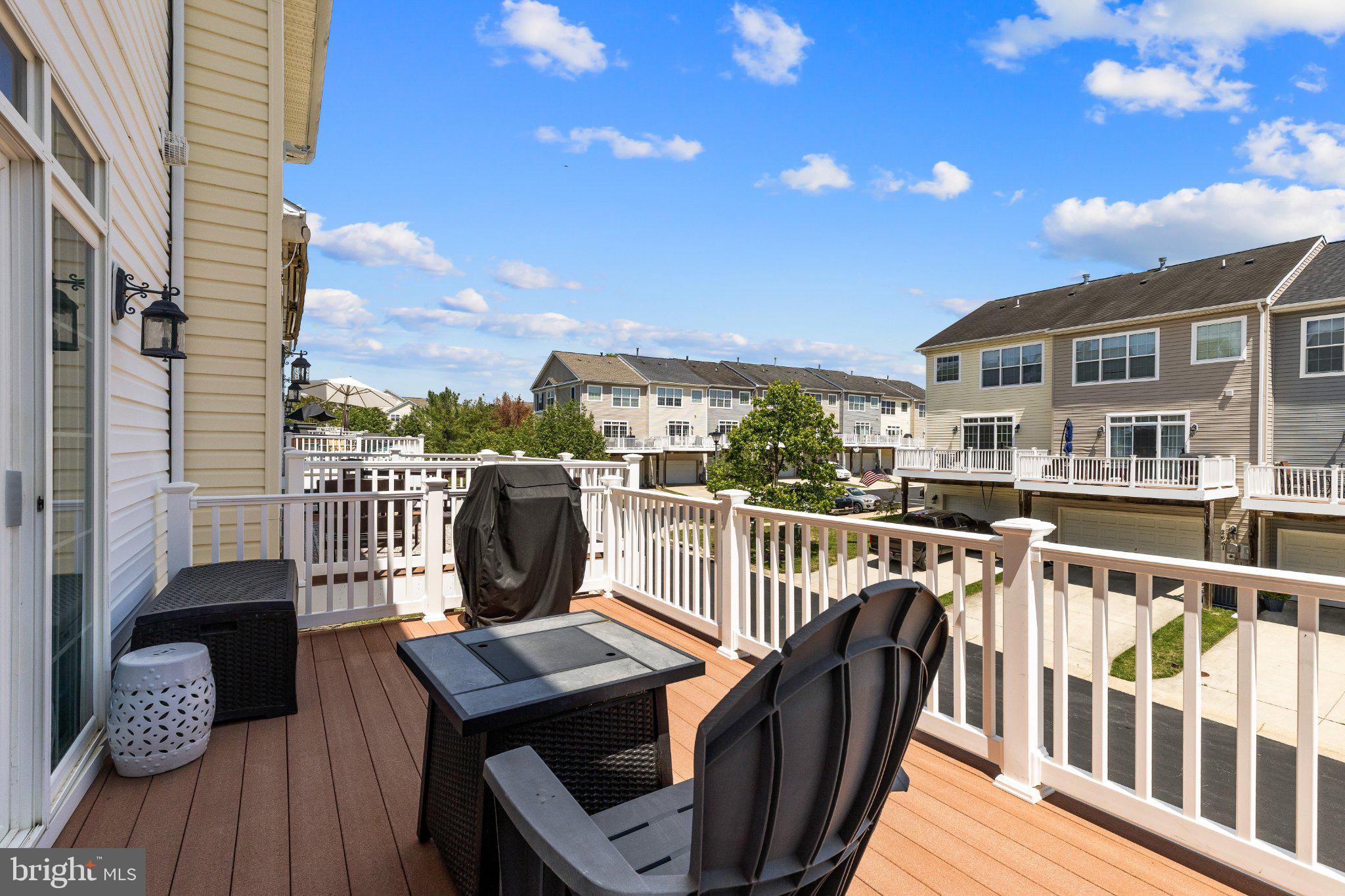 2668 Merlin Court Odenton, MD 21113 - Photo 9 of 42 a view of a balcony with wooden floor and iron fence