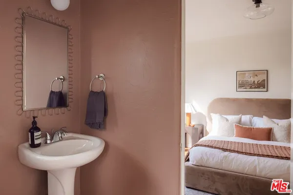 a bathroom with a sink and a mirror