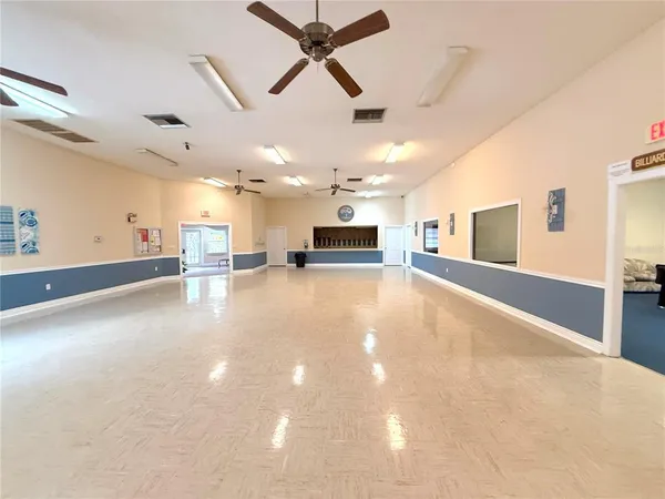 a view of a patio with a table chairs and a fire pit