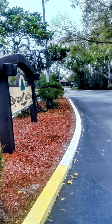 12155 Environmental Drive, Unit 6 New Port Richey, FL 34654 - Photo 40 of 42 a view of a pathway with a patio