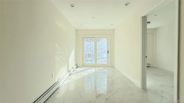 a bathroom with a tub sink and toilet