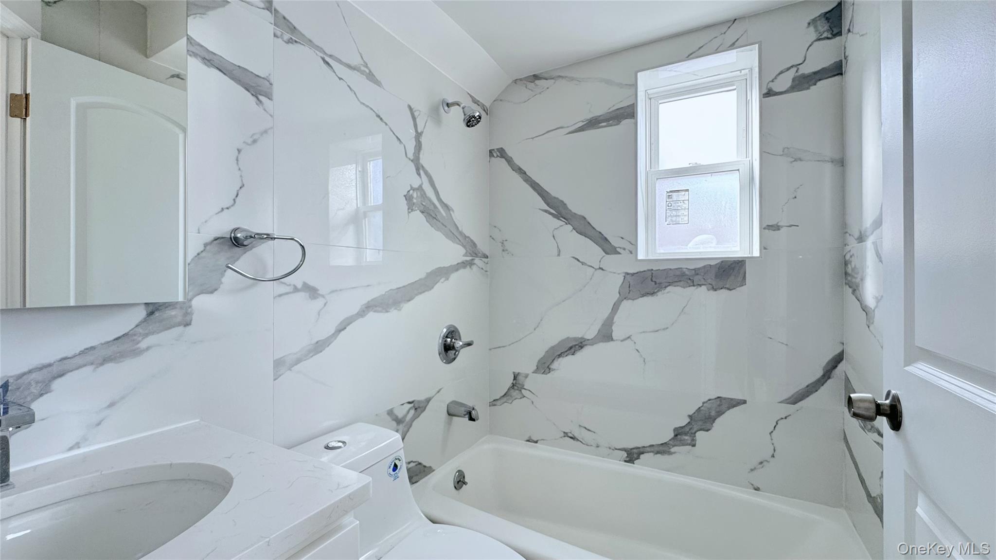 107-47 49th Avenue Queens, NY 11368 - Photo 17 of 41 a bathroom with a tub sink and toilet