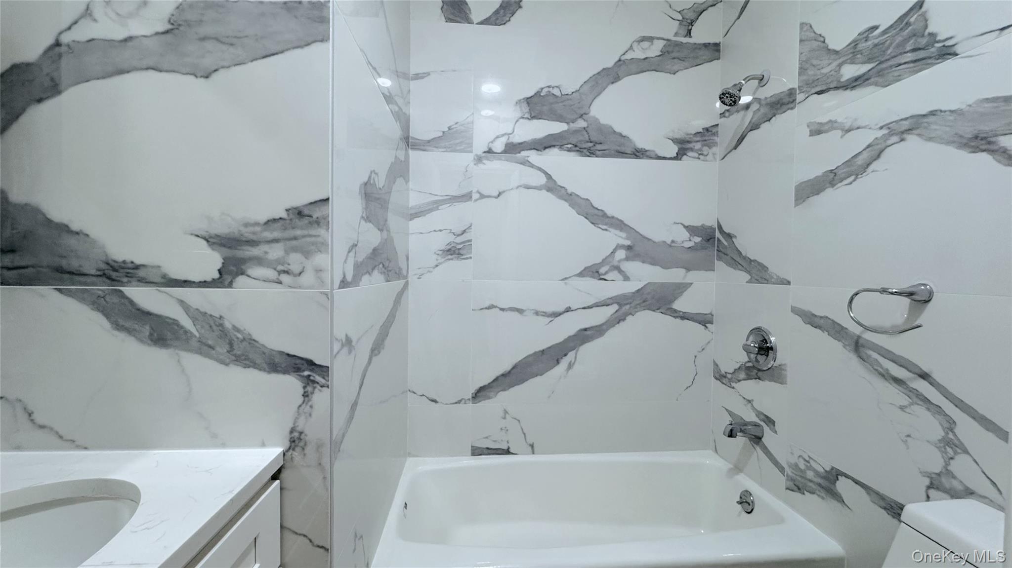 107-47 49th Avenue Queens, NY 11368 - Photo 37 of 41 a bathroom with a bathtub and sink