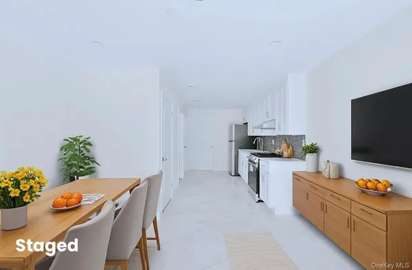 a living room with furniture and flat screen tv