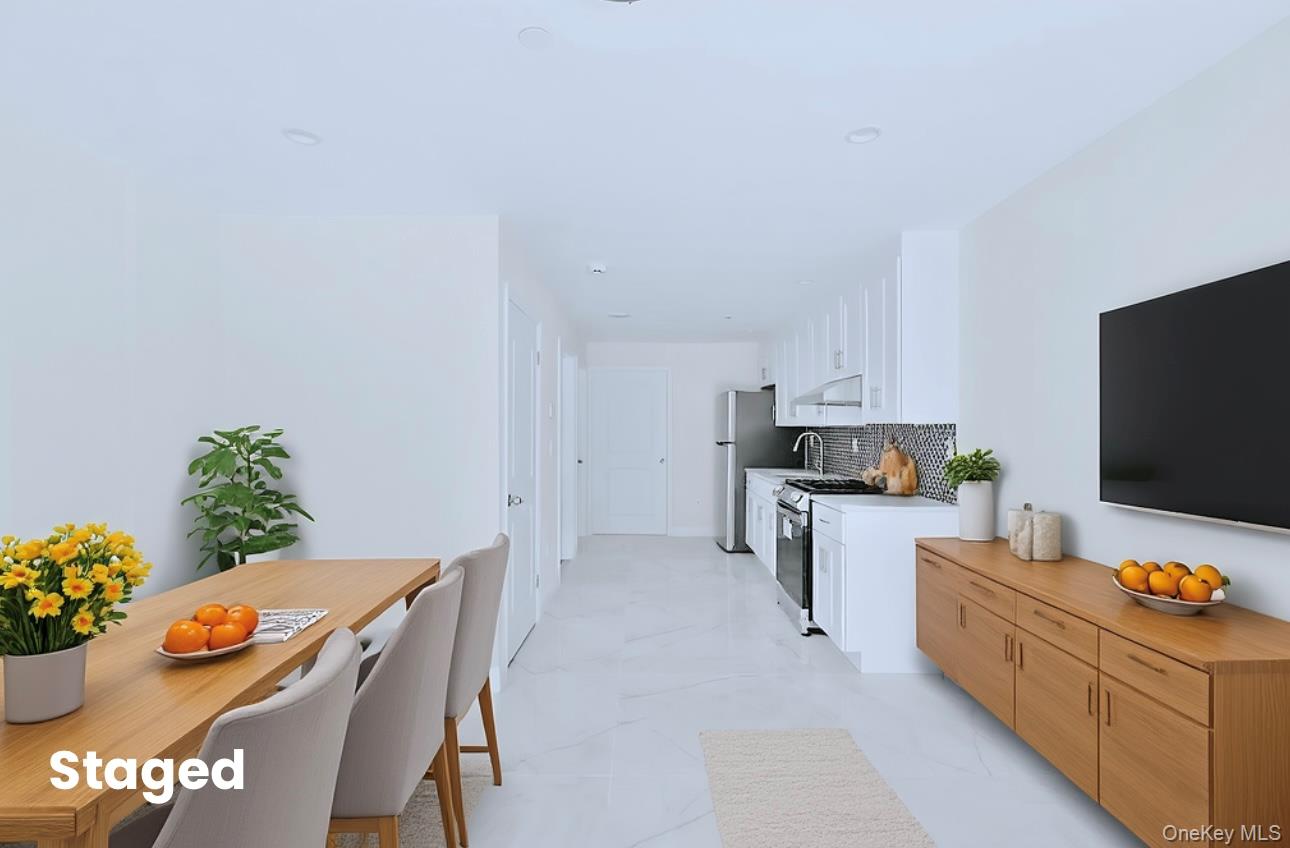 107-47 49th Avenue Queens, NY 11368 - Photo 4 of 41 a living room with furniture and flat screen tv