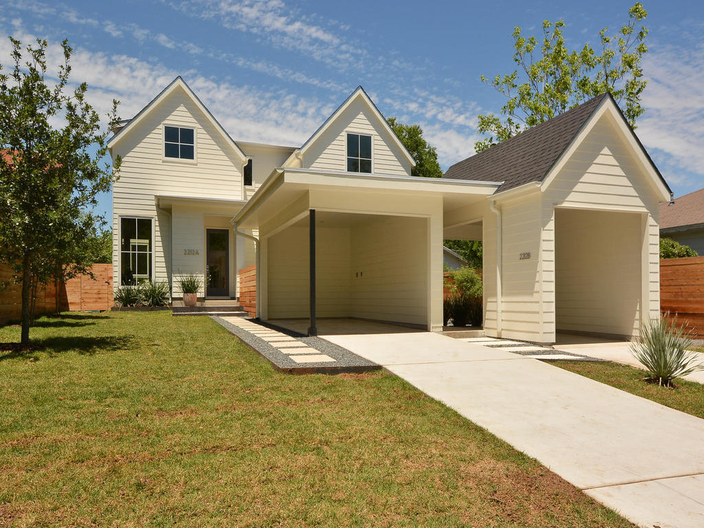 2212 Iva Lane, Unit A Austin, TX 78704 - Photo 1 of 1 a front view of a house with a yard and garage