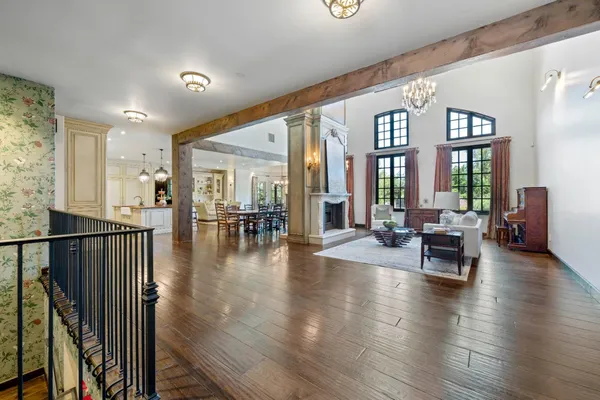 a view of living room with furniture and wooden floor