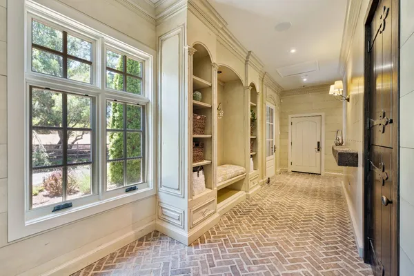 a bedroom with a large bed and a fireplace