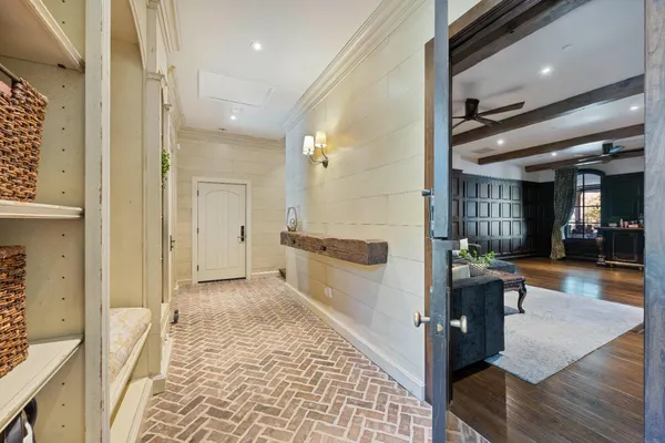 a spacious bedroom with a large bed and a wooden floor