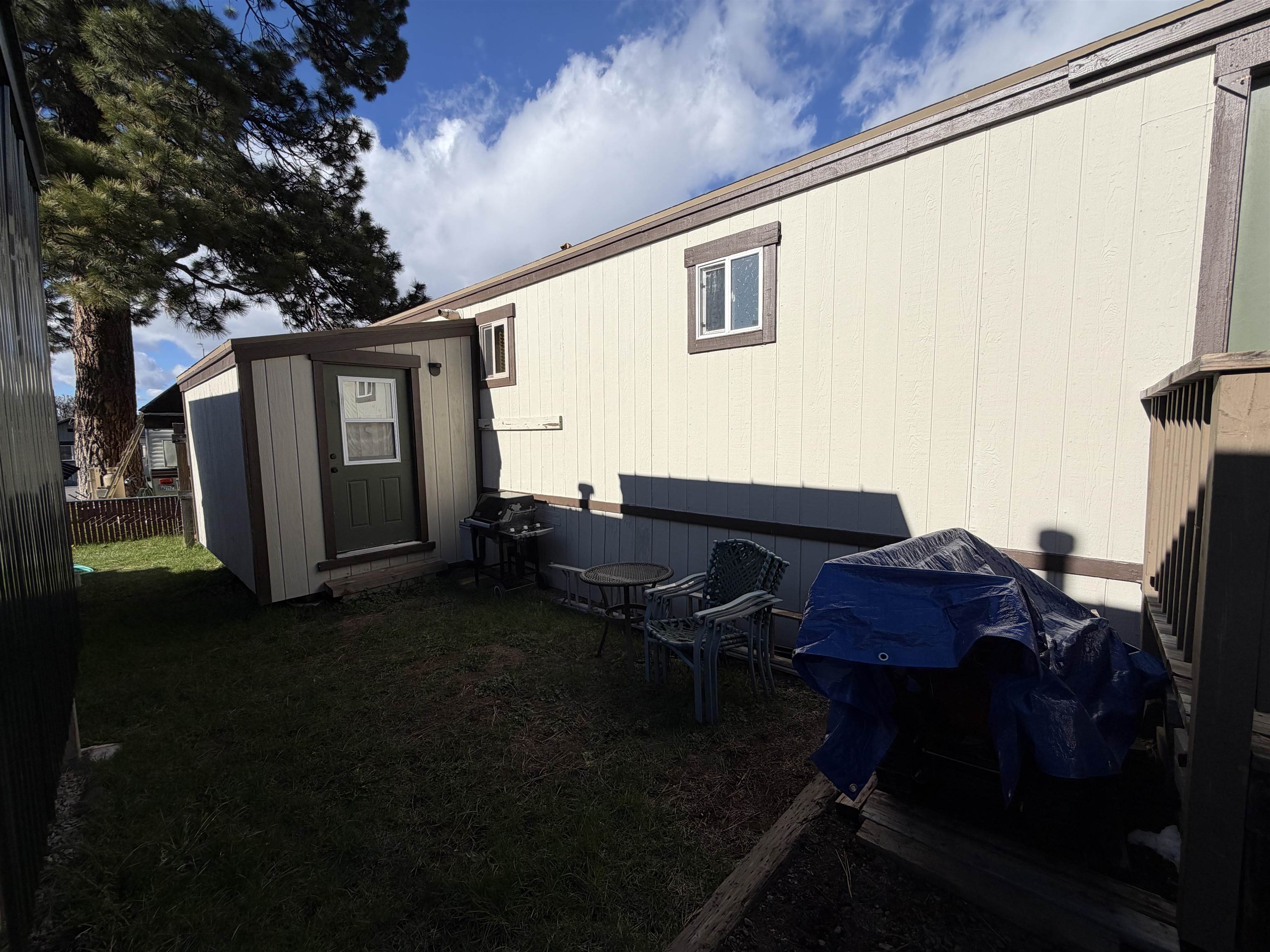 11070 Brockway Road, Unit 75 Truckee, CA 96161 - Photo 3 of 15 a backyard of a house with table and chairs