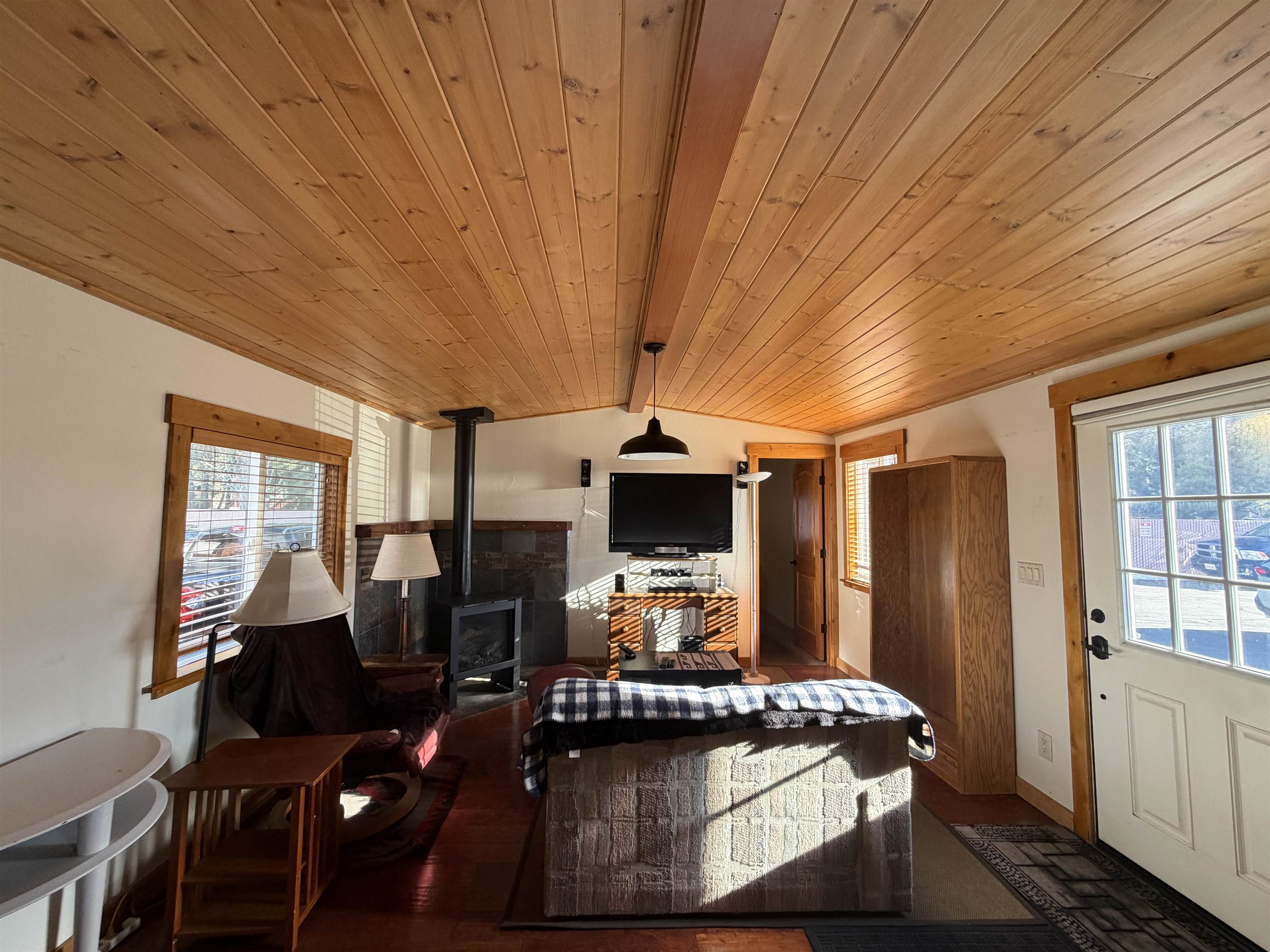 11070 Brockway Road, Unit 75 Truckee, CA 96161 - Photo 5 of 15 a living room with furniture a flat screen tv and large window