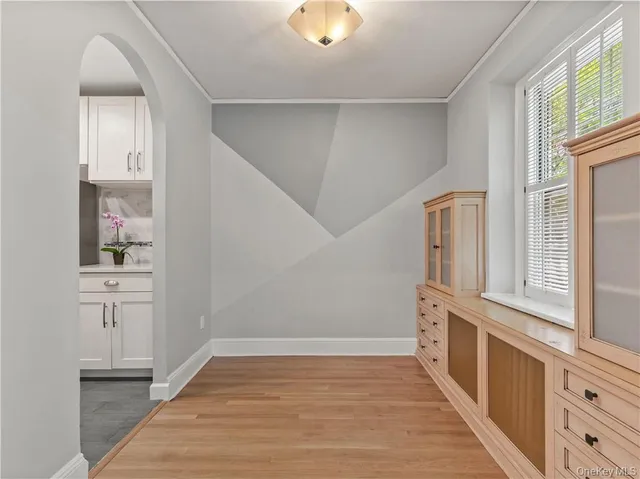 a view of a dining room with furniture and window