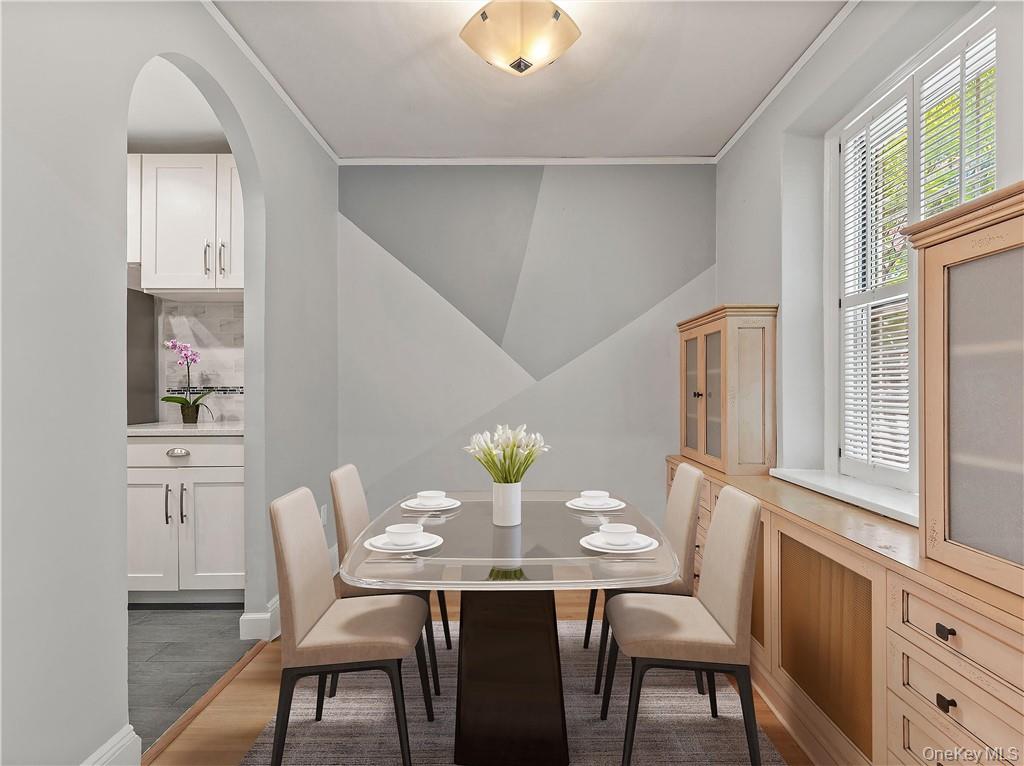 270 Bronxville Road, Unit B43 Bronxville, NY 10708 - Photo 14 of 36 a view of a dining room with furniture and window