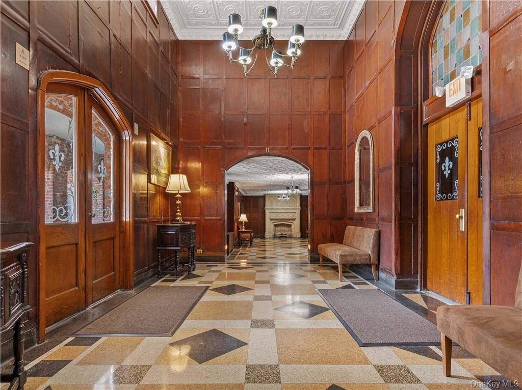 270 Bronxville Road, Unit B43 Bronxville, NY 10708 - Photo 2 of 36 a lobby with furniture and chandelier