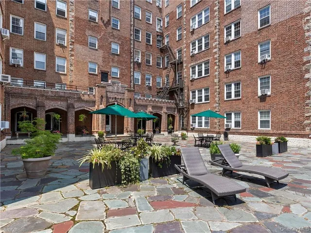 a view of multiple houses with a patio