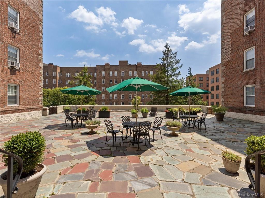 270 Bronxville Road, Unit B43 Bronxville, NY 10708 - Photo 24 of 36 a view of a patio with a table and chairs