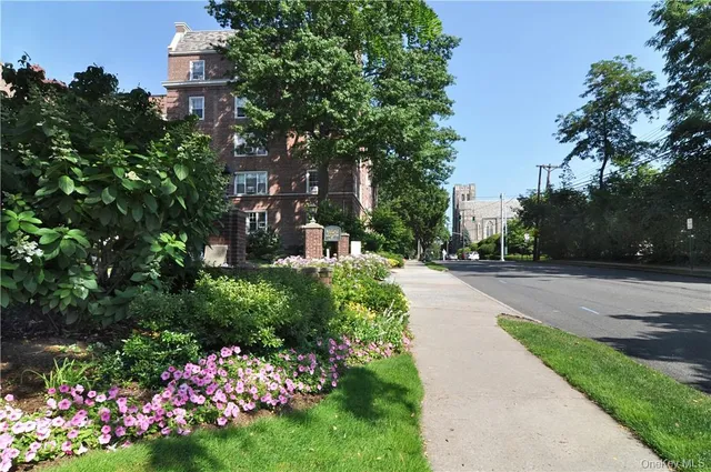 a view of street with flower on side of it