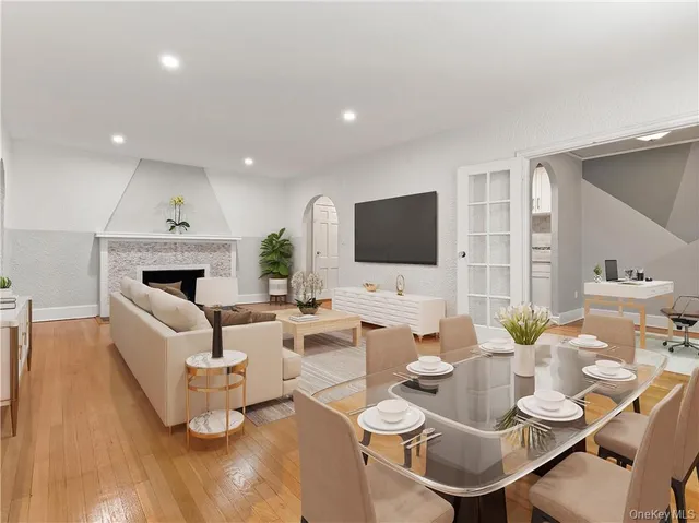 a living room with fireplace furniture and a flat screen tv