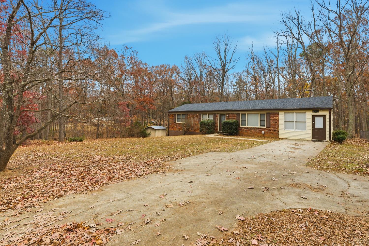 969 Hawkins Road Evington, VA 24550 - Photo 26 of 40 a front view of a house with a yard covered with snow