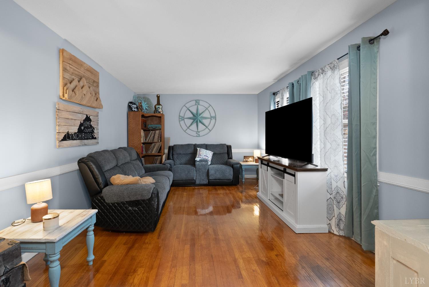 969 Hawkins Road Evington, VA 24550 - Photo 4 of 40 a living room with furniture and a flat screen tv
