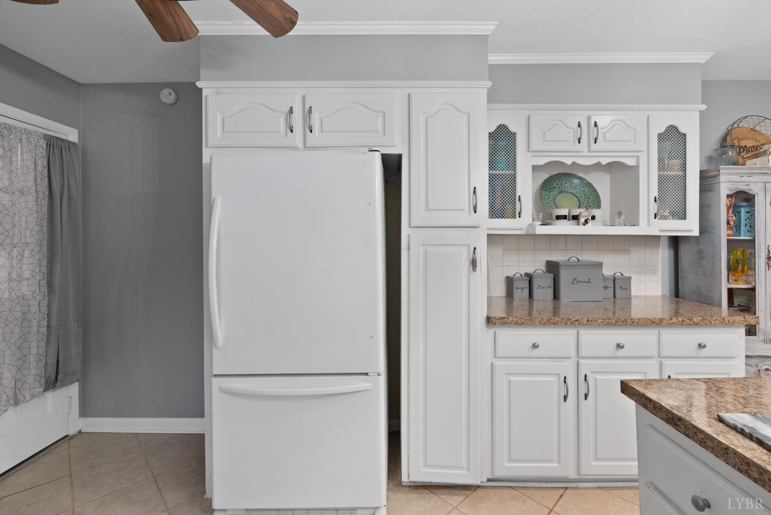 969 Hawkins Road Evington, VA 24550 - Photo 9 of 40 a white refrigerator freezer sitting inside of a kitchen