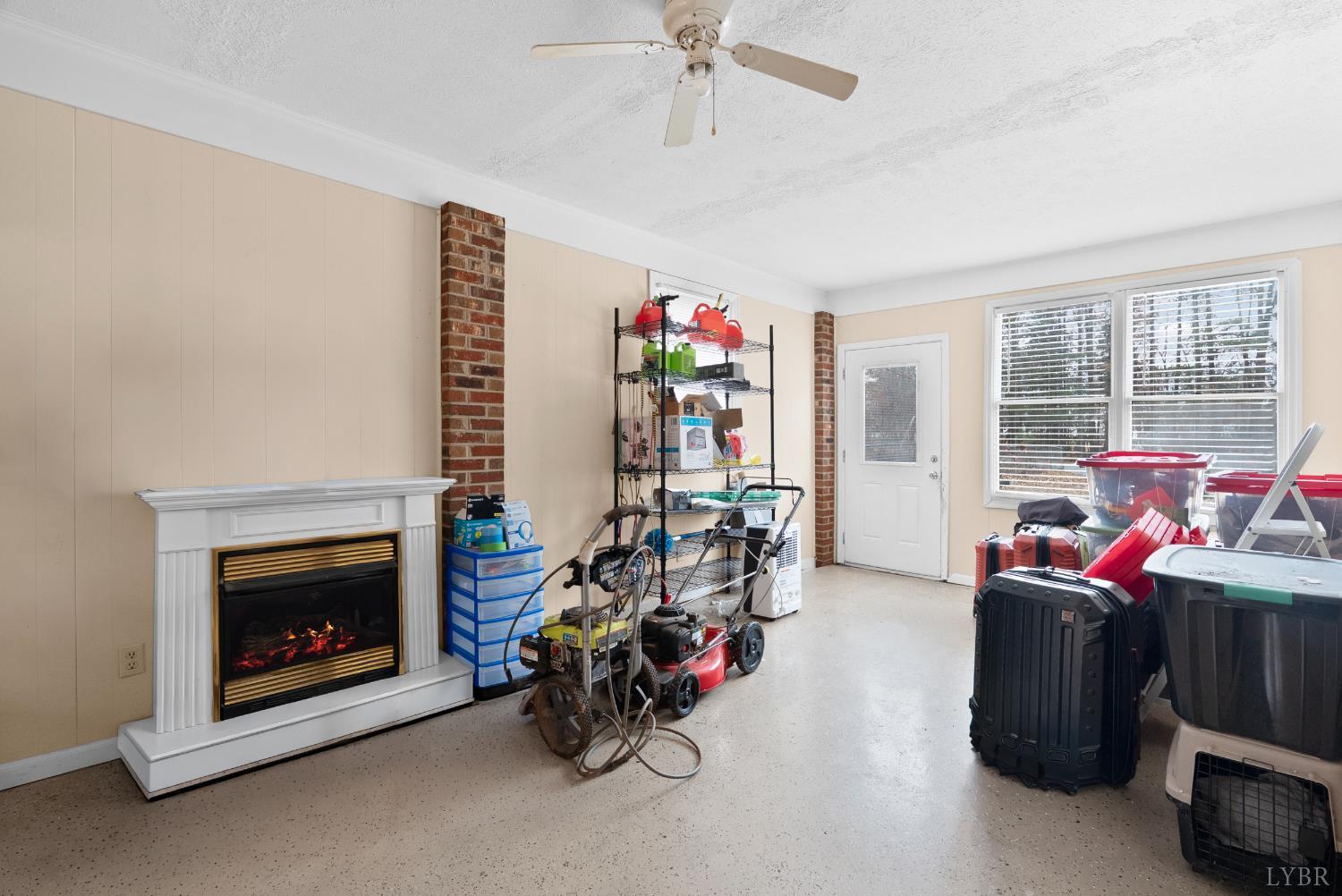 969 Hawkins Road Evington, VA 24550 - Photo 10 of 40 a living room with furniture a fireplace and a chandelier