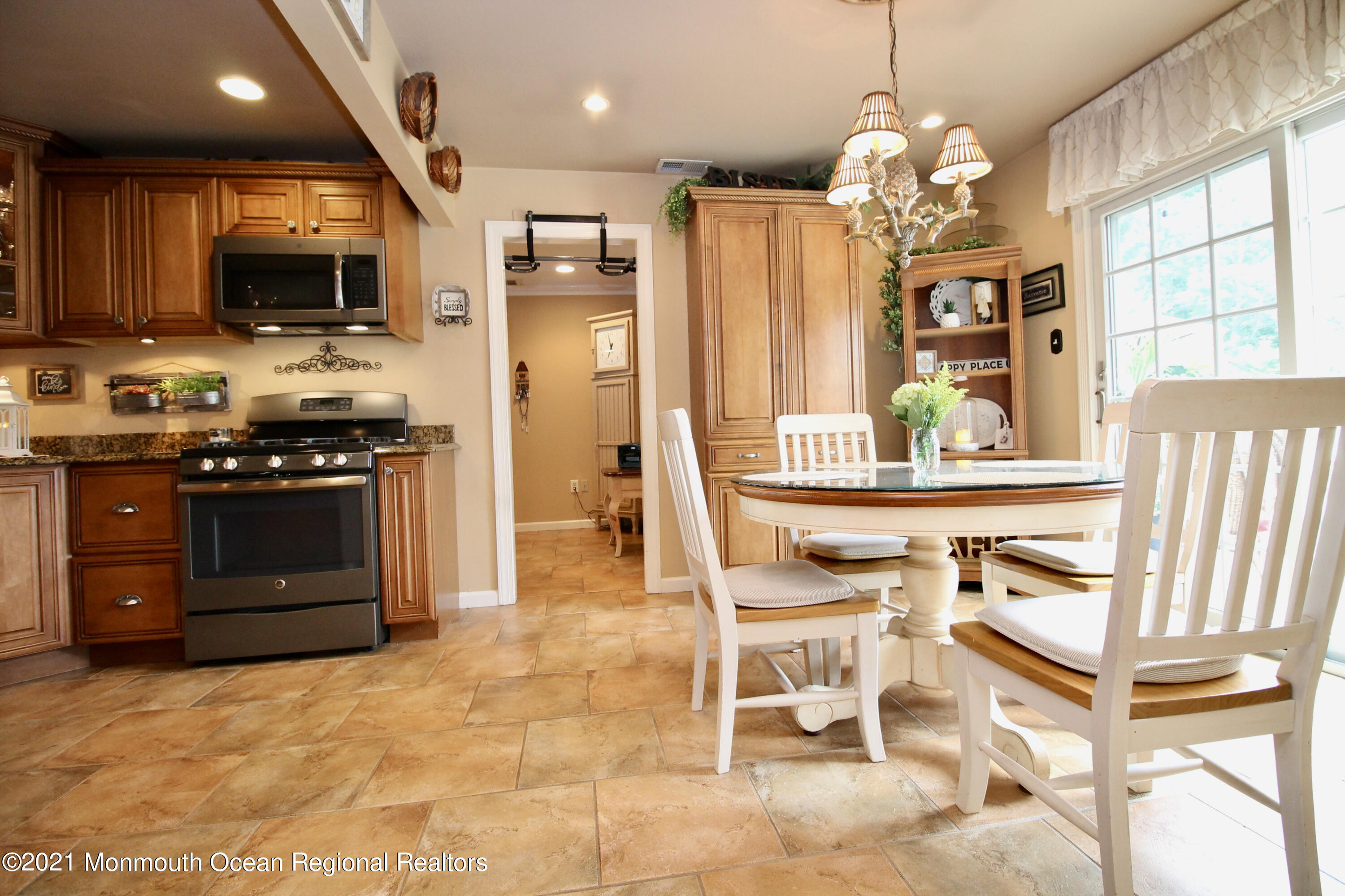 30 Potter Road Freehold, NJ 07728 - Photo 22 of 63 a kitchen with stainless steel appliances kitchen island granite countertop a stove and a sink