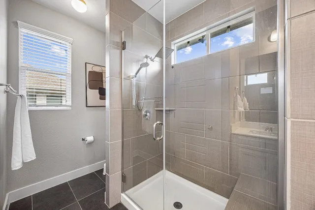 a bathroom with a shower and a toilet