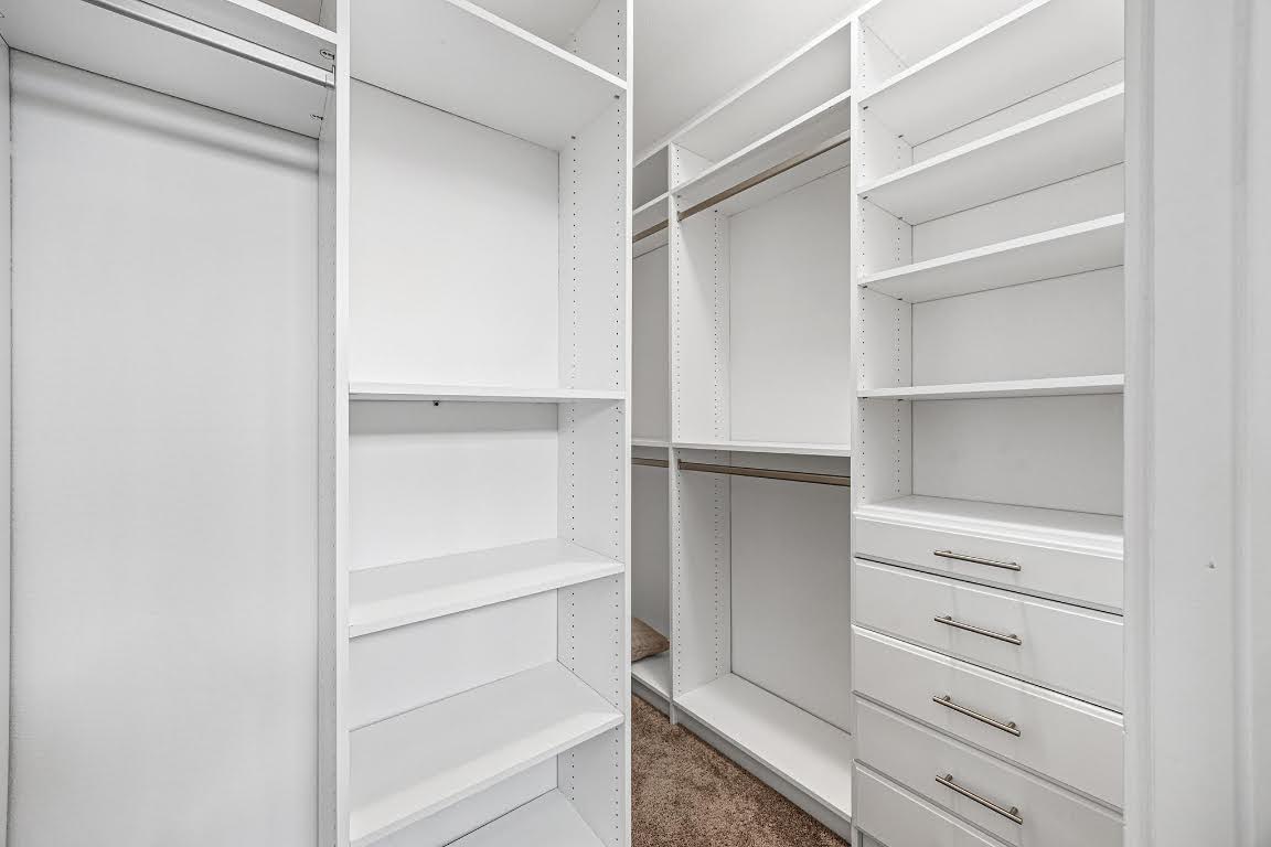 2315 Capulet Street Austin, TX 78741 - Photo 20 of 33 a view of walk in closet with empty racks