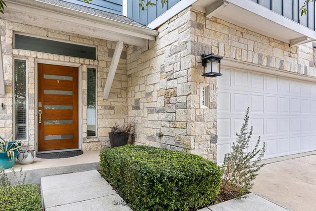 a view of a brick house with a large windows