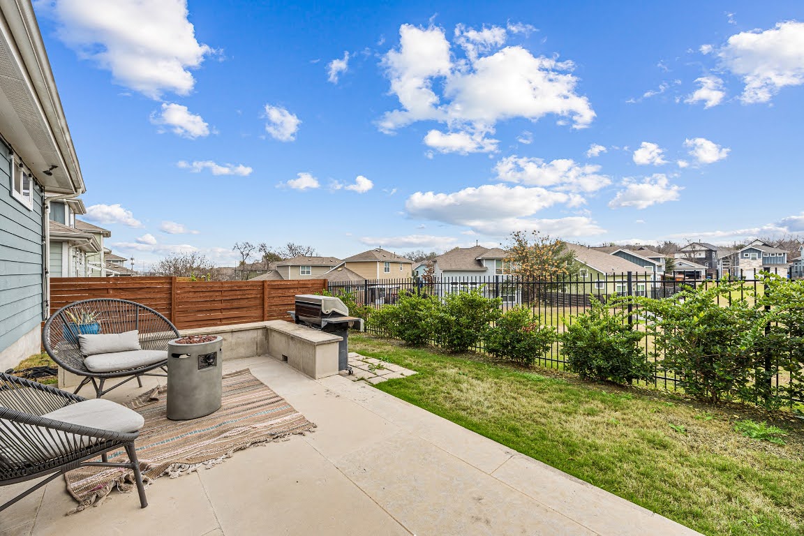 2315 Capulet Street Austin, TX 78741 - Photo 31 of 33 a view of a terrace with lawn chairs and iron fence