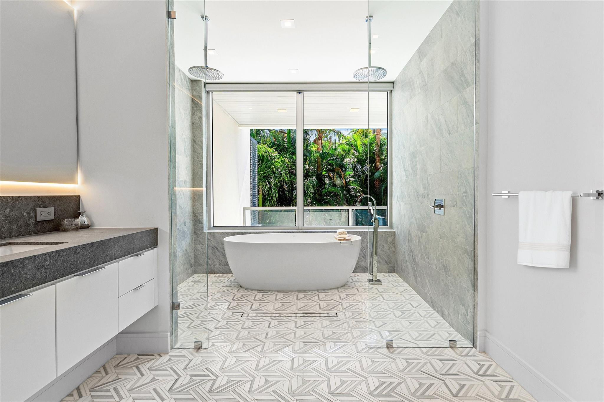 1022 Langer Way Delray Beach, FL 33483 - Photo 12 of 33 a large white tub sitting next to a window