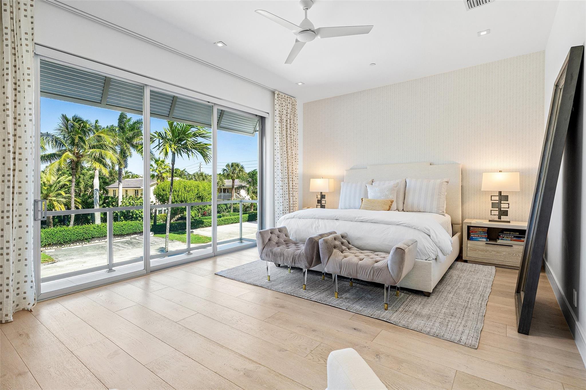 1022 Langer Way Delray Beach, FL 33483 - Photo 15 of 38 a spacious bedroom with a bed lamp and a large window