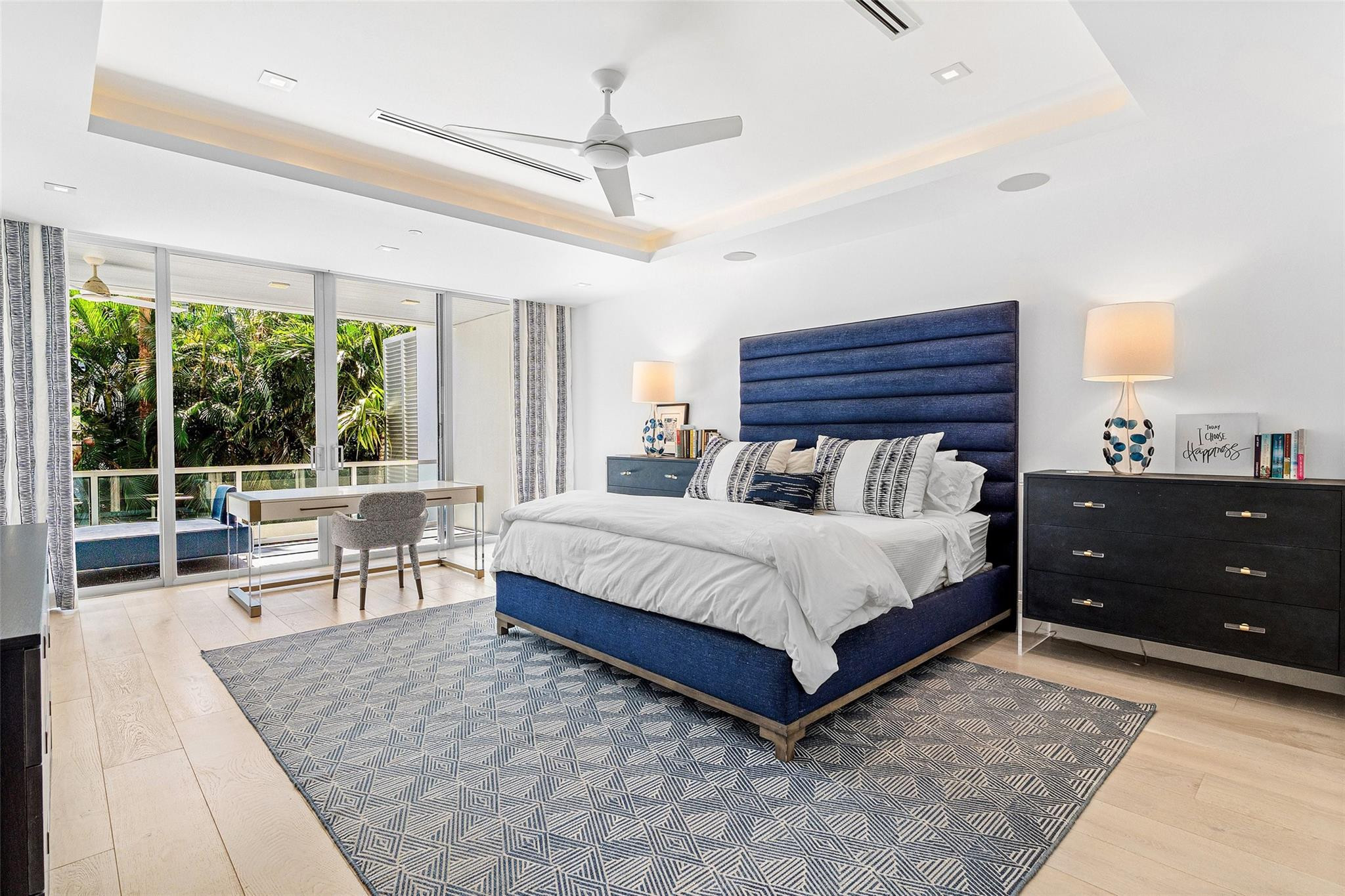 1022 Langer Way Delray Beach, FL 33483 - Photo 19 of 38 a bedroom with a bed and large window