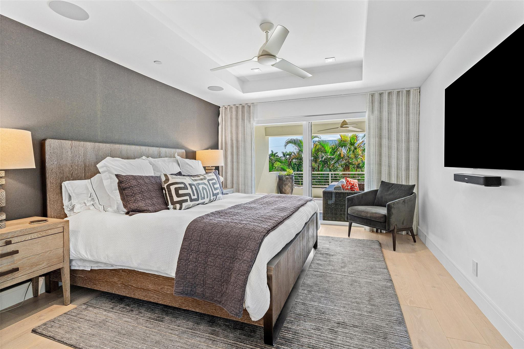 1022 Langer Way Delray Beach, FL 33483 - Photo 23 of 38 a bedroom with a bed and a flat screen tv