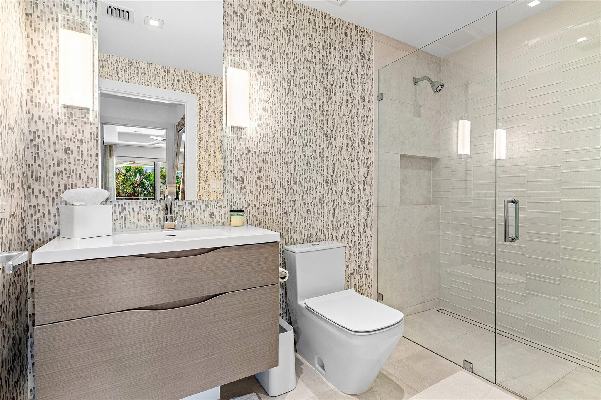 1022 Langer Way Delray Beach, FL 33483 - Photo 24 of 38 a bathroom with a sink toilet and shower