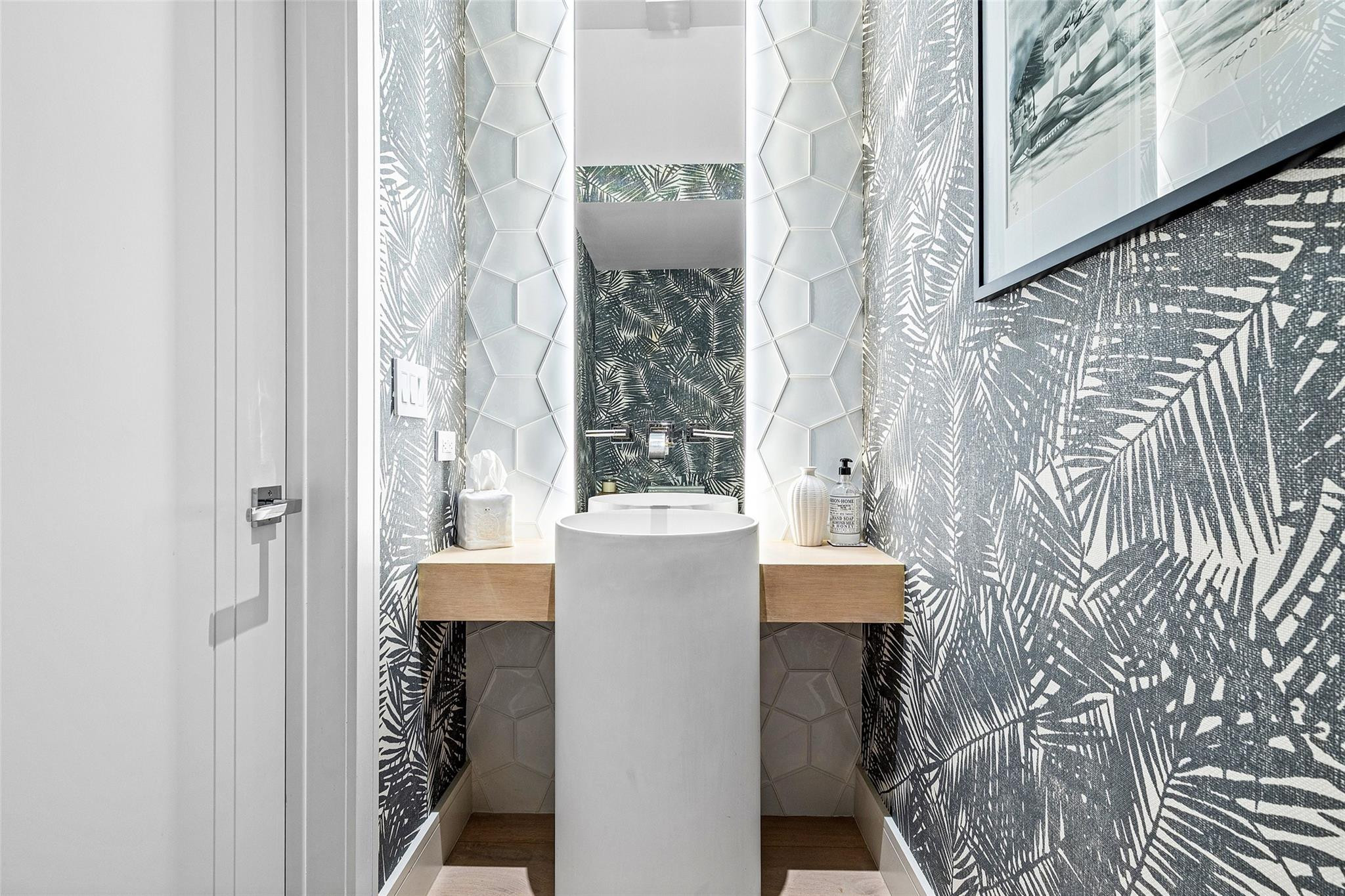 1022 Langer Way Delray Beach, FL 33483 - Photo 24 of 33 a view of a bathroom with a toilet and a shower curtain