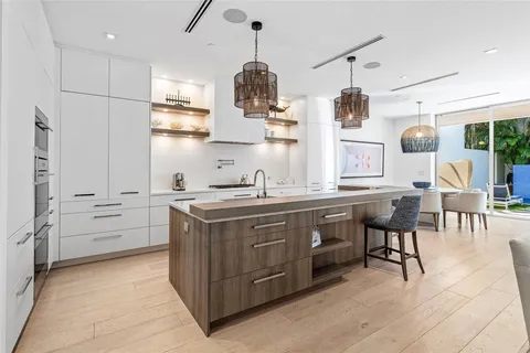 a kitchen with stainless steel appliances granite countertop a stove and a refrigerator