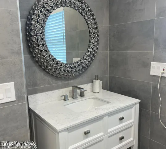 a spacious bedroom with two beds and a large window