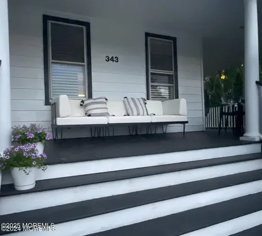 a living room with furniture and a rug
